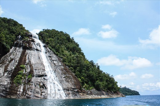 Mursala Waterfall in Indonesia, a 40 m waterfall falls directly into the Sea 