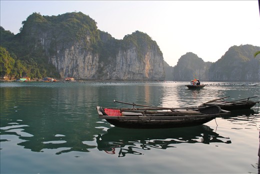 A family on their way to tend to an oyster farm in the early morning