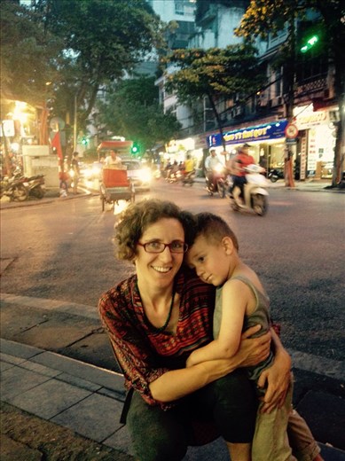 Hanoi streets by night, when you cross, go slowly so that scooters can go around you.