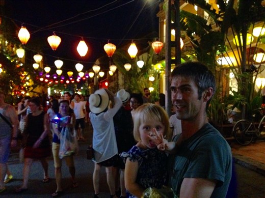 Chris and Livia in a lively Hoi An street by night.