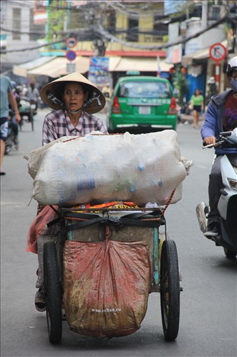 Her everyday job is searching trash cans for bottles, gathering them up for sell