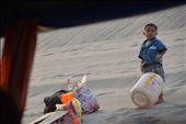 This boys face looks so innocent whilst his mother unloads the ferry trip after their rountined trip for supplies. I cant help but wonder what he's thinking.: by harper1, Views[729]
