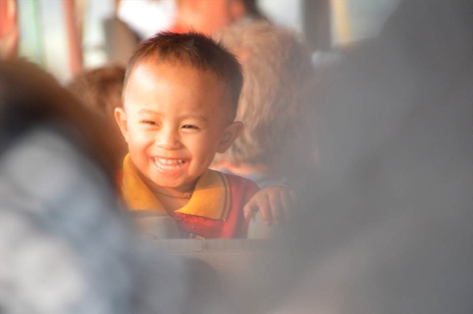 The journey down the Mekong River can be dull, sad and poor, So when i saw this sweet boy laughing with tourists, I couldn't resist taking this picture- the feeling I had when capturing this moment is portrayed beautifully in this image with the sun shining through. Bright, happy and full of hope.