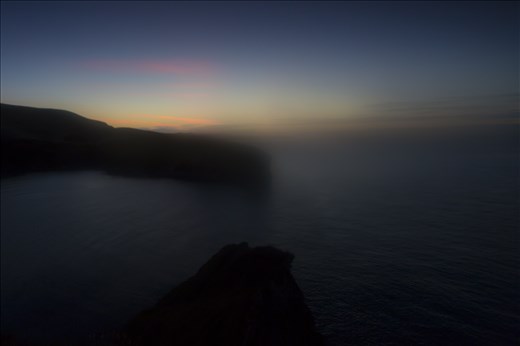 A haze filled dawn over the Dorset coast