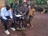 Visiting an old wheelchair who lives in an uphill area. He repaired the footpad by adding a piece of a plastic bucket material to comfort himself more. The callous along his legs caused by sitting on the ground for hours or crawling in order to do certain things which is easier without his wheelchair. Awareness of isolation prevention makes him always be near with his cellphone. In lack of luxury, a rosario hanging on his neck represents his religious character.: by hastutiishere, Views[619]