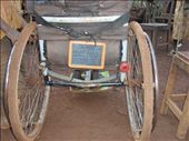 A Kiswahili-version bible verses reminder board attached at the back of the wheelchair. It makes him easy to carry along the uneven terrain to go to the church and avoid him from being forget to bring that stuff.: by hastutiishere, Views[650]