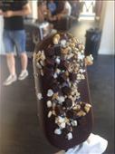 My customized Magnum bar. I chose to have a vanilla ice cream bar dipped in dark chocolate, topped with caramel popcorn pieces, pretzel pieces, and brownie bites, and drizzled in milk chocolate, Florence: by hayleythenomad, Views[312]