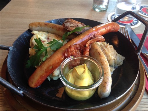 Two types of sausage, sauerkraut, mashed potatoes with onions, fried bacon, brown bread, and mustard = the most German meal ever, Munich