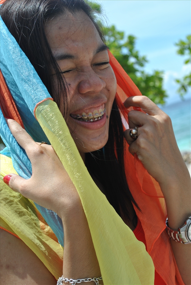 My sister having a laugh about her scarf being blown by the wind.