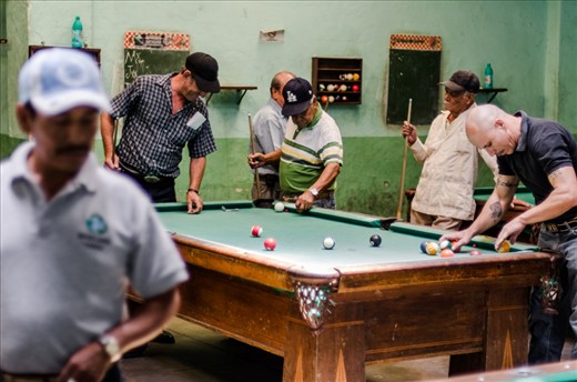 Pool players re rack a game and gather winnings after game finishes in a pool bar in Tepic, Mexico.
Some of these players told us about their time spent in mexican jails, but at the same time were friendly and allowed me to take photos.