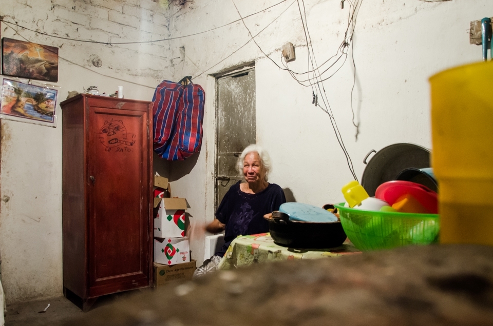 An Old Lady, reacts to having her photo taken in her home near San Blas, Mexico. We were welcomed into this house for a homemade tequlia by the old Lady's son. 