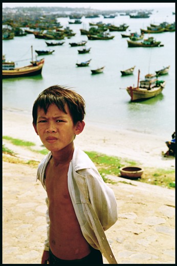 During a break in a fisherman's village, a young man allows an honest portrait