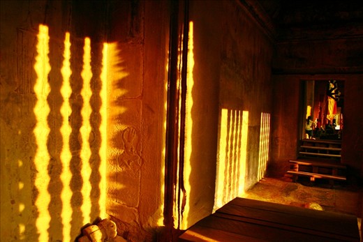 Sunset reflection on the wall inside one of the temples at Angkor, Siem Reap