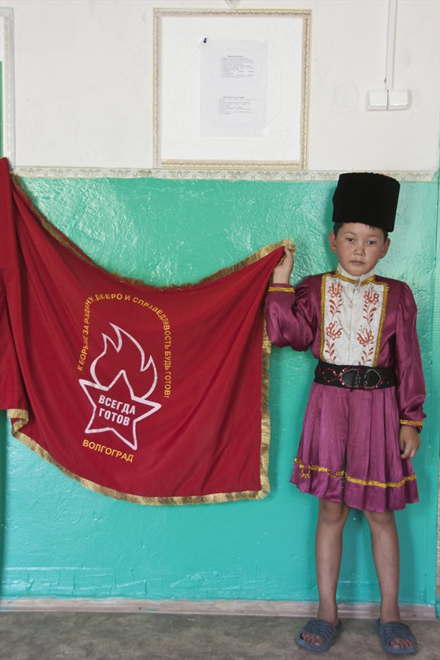 A little boy that is still a Pioneer, like in the Soviet times