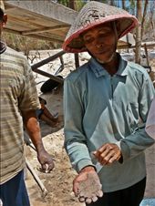 A man clutches the sand containing his living. Gold is extracted from the sand. After many filtration processes, mercury - despite being illegal in Indonesia and damaging to the miners’ health, is used to extract the gold.: by hharrison, Views[311]
