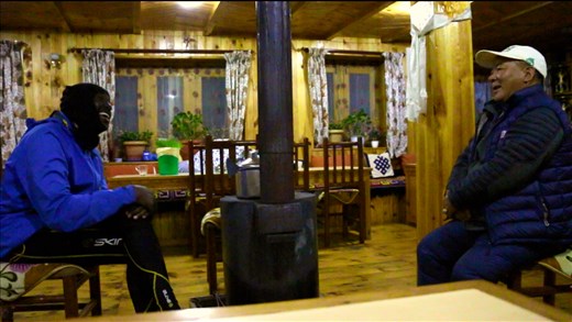 By the fire place with Nawang Yonden Sherpa photo Credit; Joe Bunyan