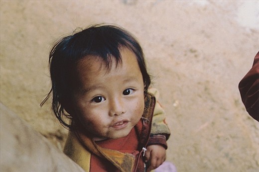 Nearing the Black Hmong village, we encountered some muddy, but friendly little faces.