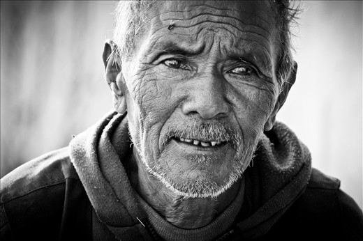 Deep wrinkles tell a story of a hard life of toil, worry and survival 