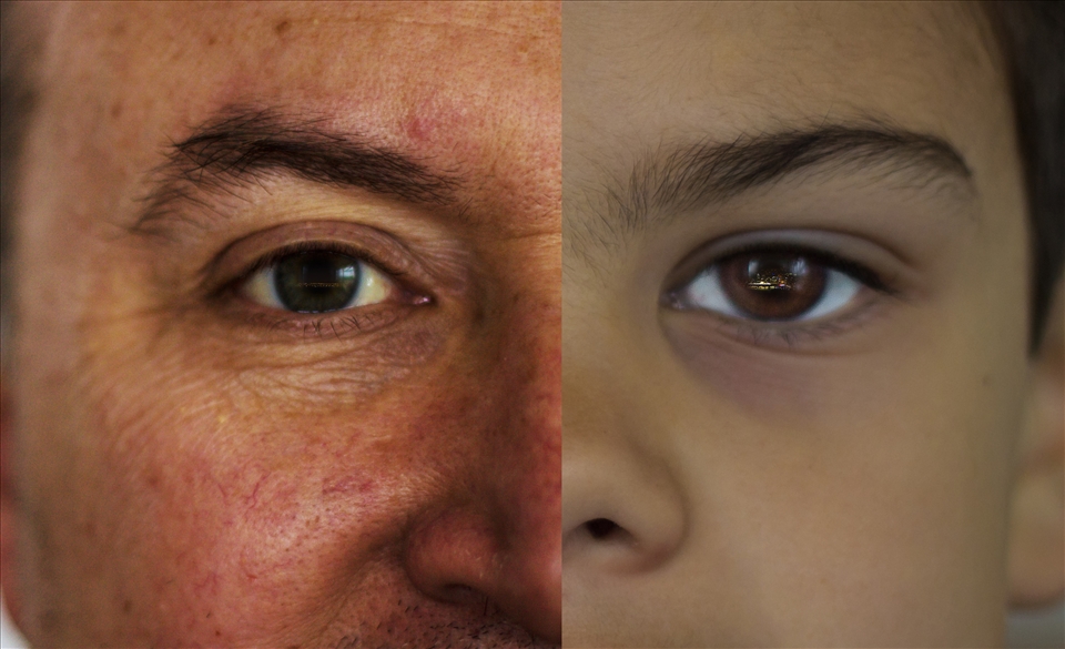 Father and son with the view from their house in their eyes