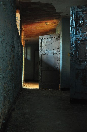 Behind the doors in this hallway were rooms of those who came to recuperate at the sanatorium.