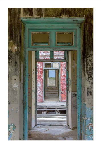 Doors and windows line up in an abandoned lighthouse on the uninhabited island of Klein Curacao. Once a beacon for ships, the building has since fallen into ruin and disrepair.