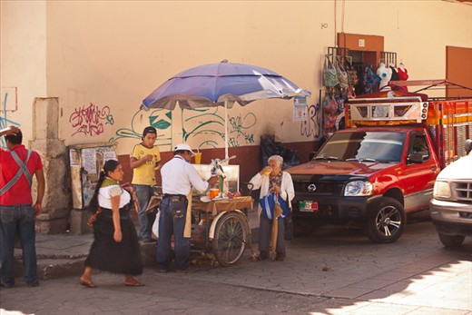Pedestrians, vendors and traffic all share the same space
