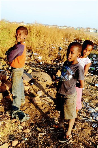 Friends playing by the dump site
