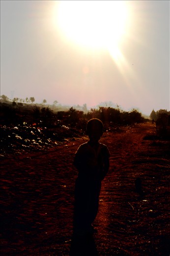 This is a photo of a boy I saw standing in the street waiting for his friends