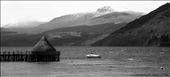 Out in the vast open Loch Tay, a small boat struggles against the tide whilst a wooden crannog sits unchanging. It is the middle of May and the snow atop the looming Beinn Ghlas mountain is beginning to melt. Summer is approaching Scotland.: by hollyelizabeth, Views[543]