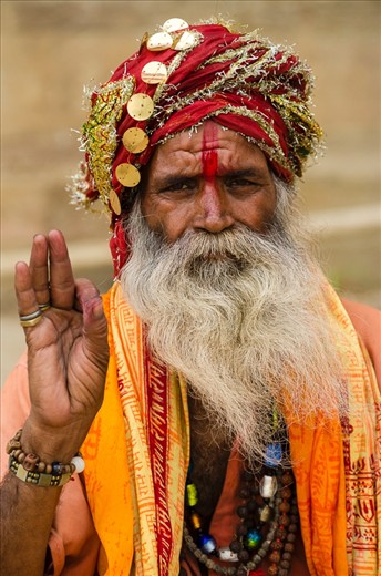 Another portrait of a Sādhu (wondering monk), this time taken in the holy city of Varanasi, India. His right hand is raised in protest against war and violence. These holy men can be found throughout India and some of it’s neighboring countries.