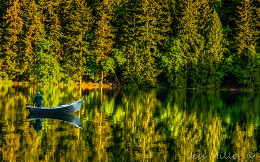 Peaceful man

This was shot on a beautiful early morning at Battle Ground Lake, WA This man looked peaceful on the still waters and had to capture the moment. 