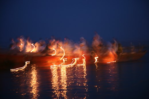 Hindus and travelers alike float the symbols of their dedication to Lord Shiva.