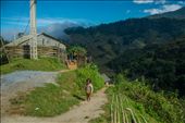 A little girl seems bewildered as she stands outside her house atop a hill.: by hungontheworld, Views[335]