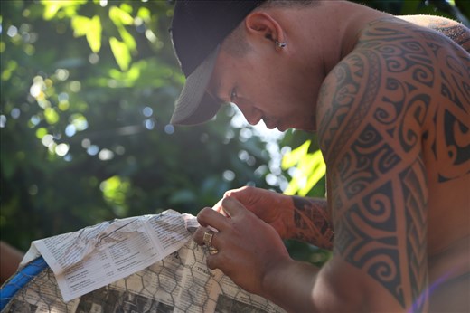 Young Tahitian dancer is working on an accessory for his costume. The Heiva festival is not just dancing, but it is also storytelling. The costumes of the dancers have to be aligned with the story of the performance. The possibilities for costume materials are only restricted by the boundaries of creativity and imagination.