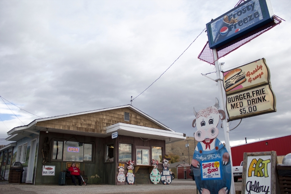 Kali Star waits for her Trailways bus outside the Frosty Freeze in Drummond, Mont. on Oct. 19, 2012. The diner opened May 24, 1962 and is one of the town’s enduring businesses. 