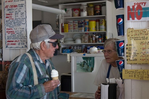 Smith, right, serves ice cream to Fred Weber, a shepherd and cow herder who lives on the outskirts of Drummond.  
