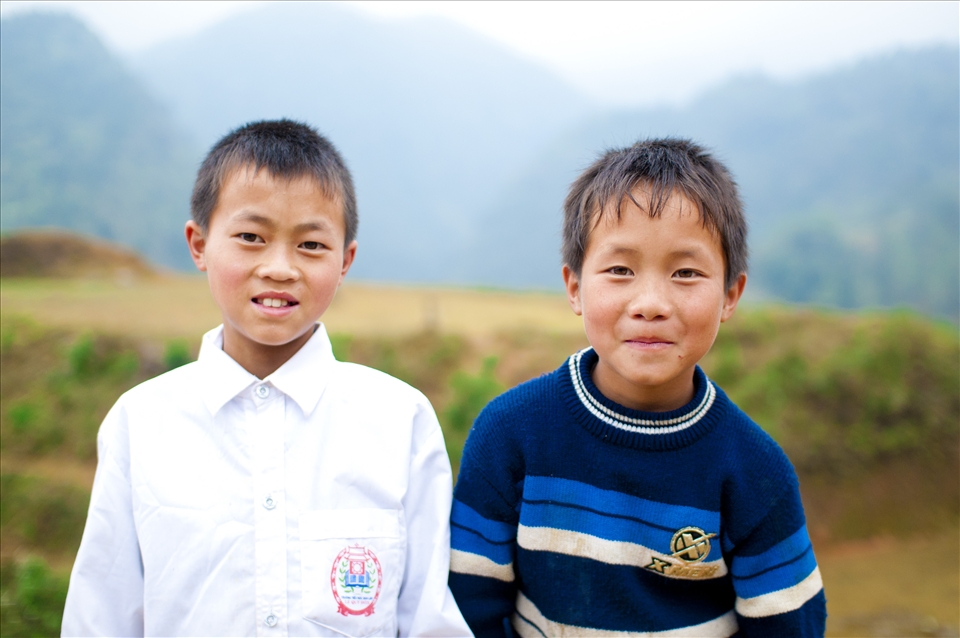 When I travel to Western countries, I have to ask for permission to take pictures of people, especially children. Here in the countryside of Vietnam, especially poor places like mountain villages in Sapa, kids run after you to have their pictures taken. 

In this picture, I love the way these two boys smile. So shy yet so bright.
