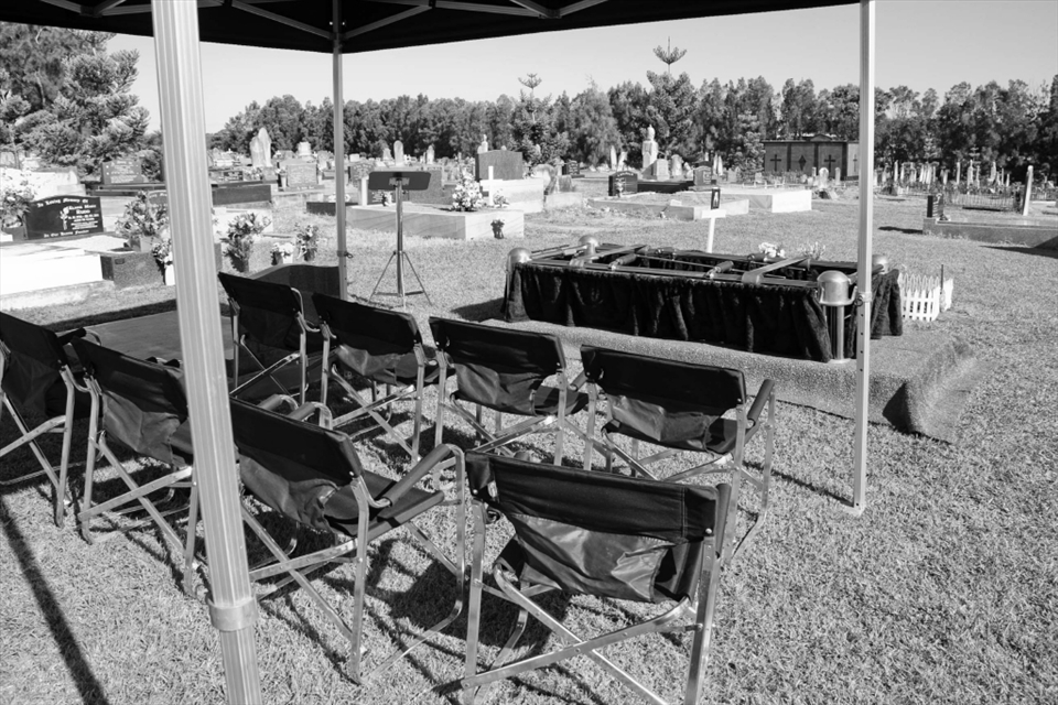 A grave site ceremony for a burial. The finial goodbye of a loved one.