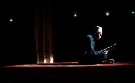 An indonesian international student is studying inside the Azhar-mosque under the sun's golden rays which coming through a small opened window up in the ceiling.this mosque used to be an important distenation for eny student who is interested in Islamic studies.