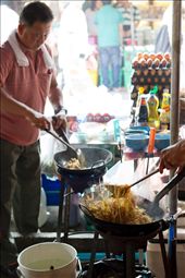 Chefs are cooking Pad Thai (possibly the most famous dish outside of Thailand) at the Chatuchak weekend market in Bangkok.: by igory, Views[920]