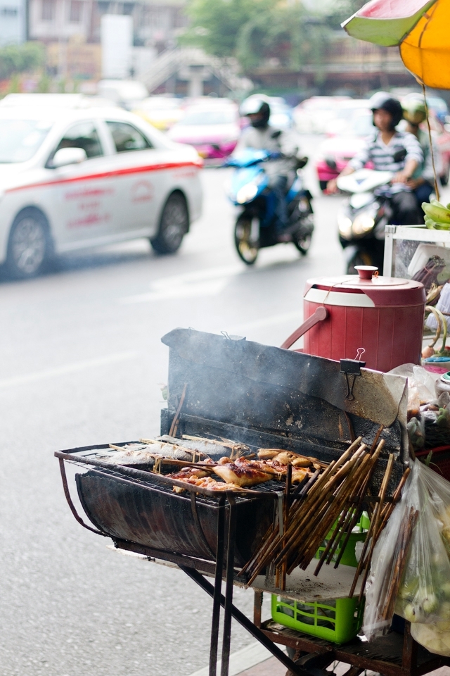 Great variety and amount of street food in Bangkok forces street vendors to locate even on the busy carriageways such as Wongwian Yai Circle in Bangkok, Thailand. 