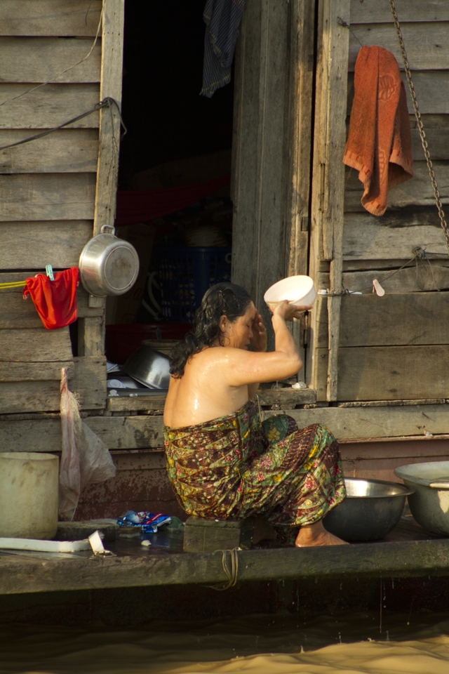 a lady bathing by the lake