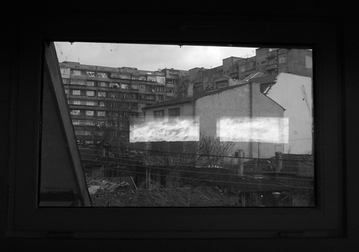 A small oasis of reflections in the desert of asphalt and concrete.