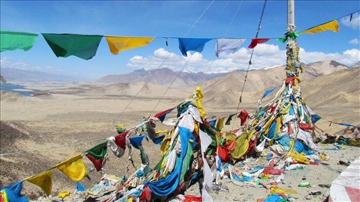 Tibetan prayer flags with the Yarlung Tsampo River in the background. 