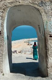 Passing by a gate, there stands the lady in blue, completing the view.: by inta, Views[259]