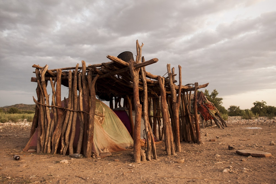 Lured by modern amenities, Himbas are struggling to keep their traditions. Many don't build huts anymore, using tents bought in town, lightly shaded with twigs.