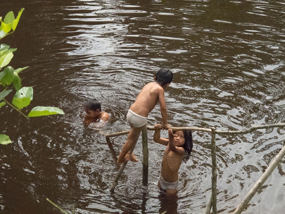 Children playing in the Amazon river