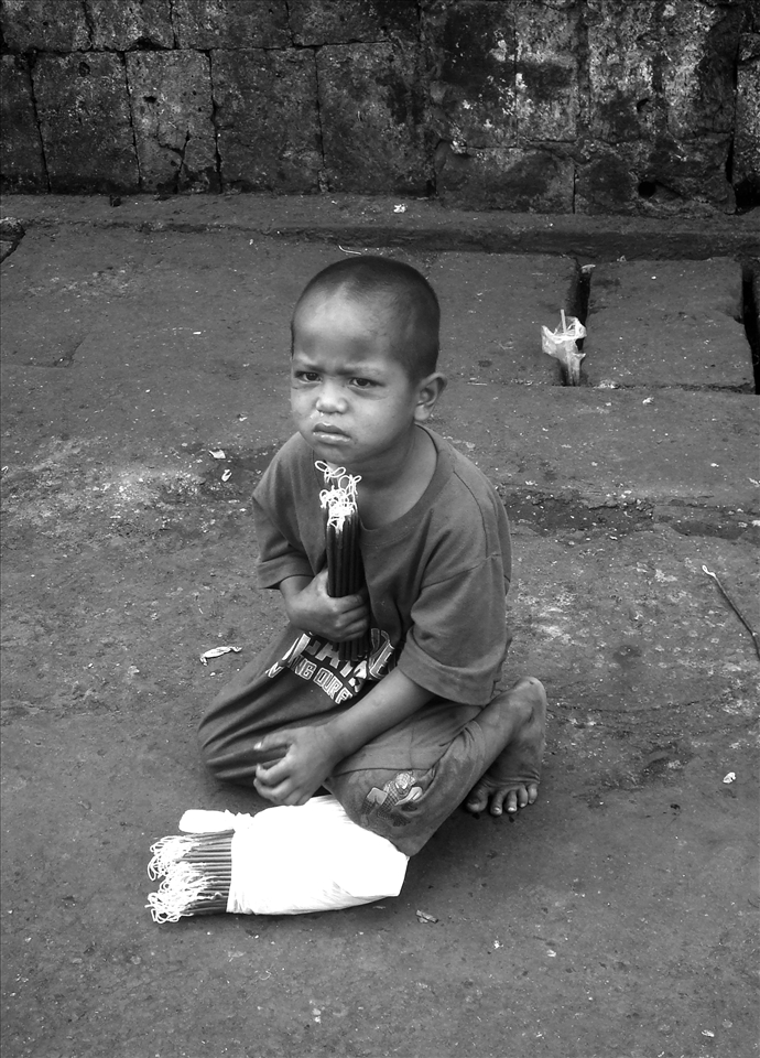 At four he roamed the streets with his older siblings selling candlles.