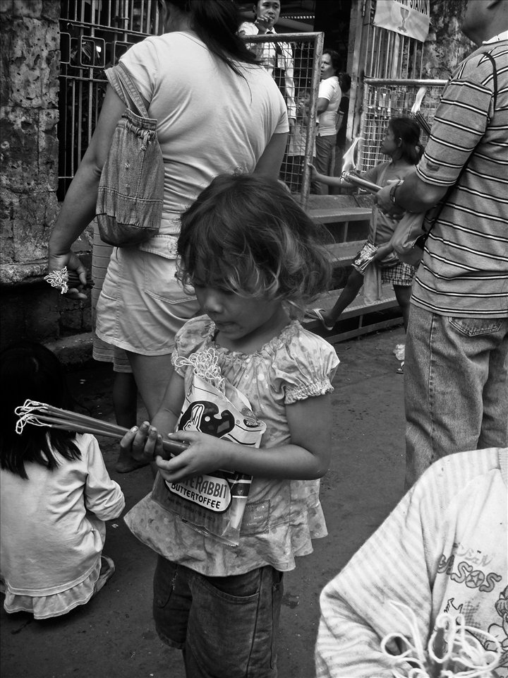 Children offer candles and ‘sinug’ (dance veneration) in exchange for few peso. 