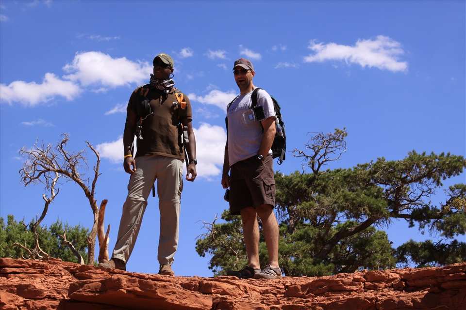 A portrait of two friends enamored by the Grand Canyon scenery